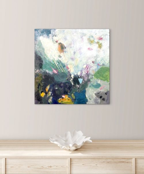 Encaustic painting hanging above a table