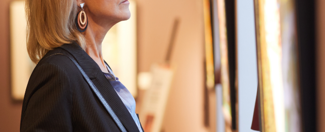 woman looking at art in a gallery