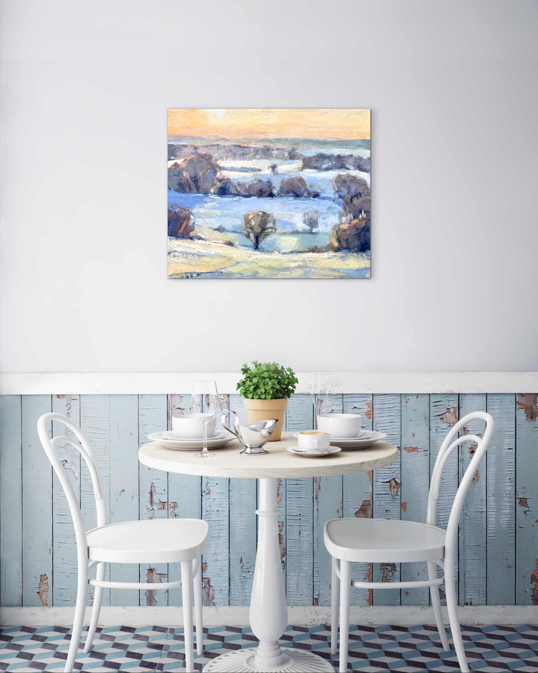 winter landscape painting shown above table and chairs as a design idea for collectors
